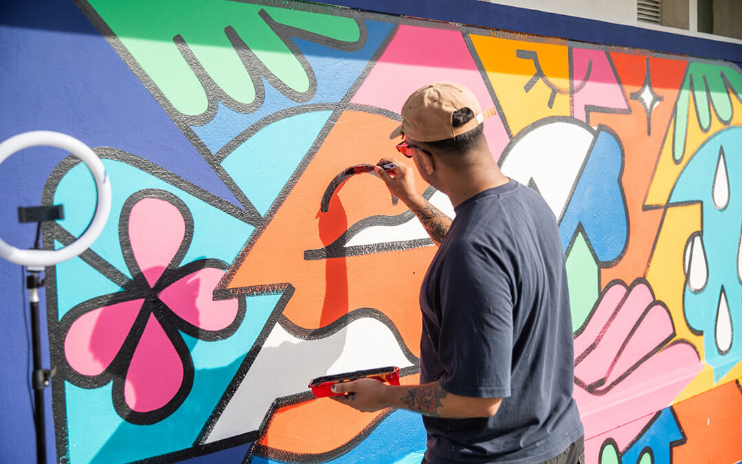 Russel Abrahams (Yay Abe) creating his mural for Blok and SJ Artists on the Sea Point promenade